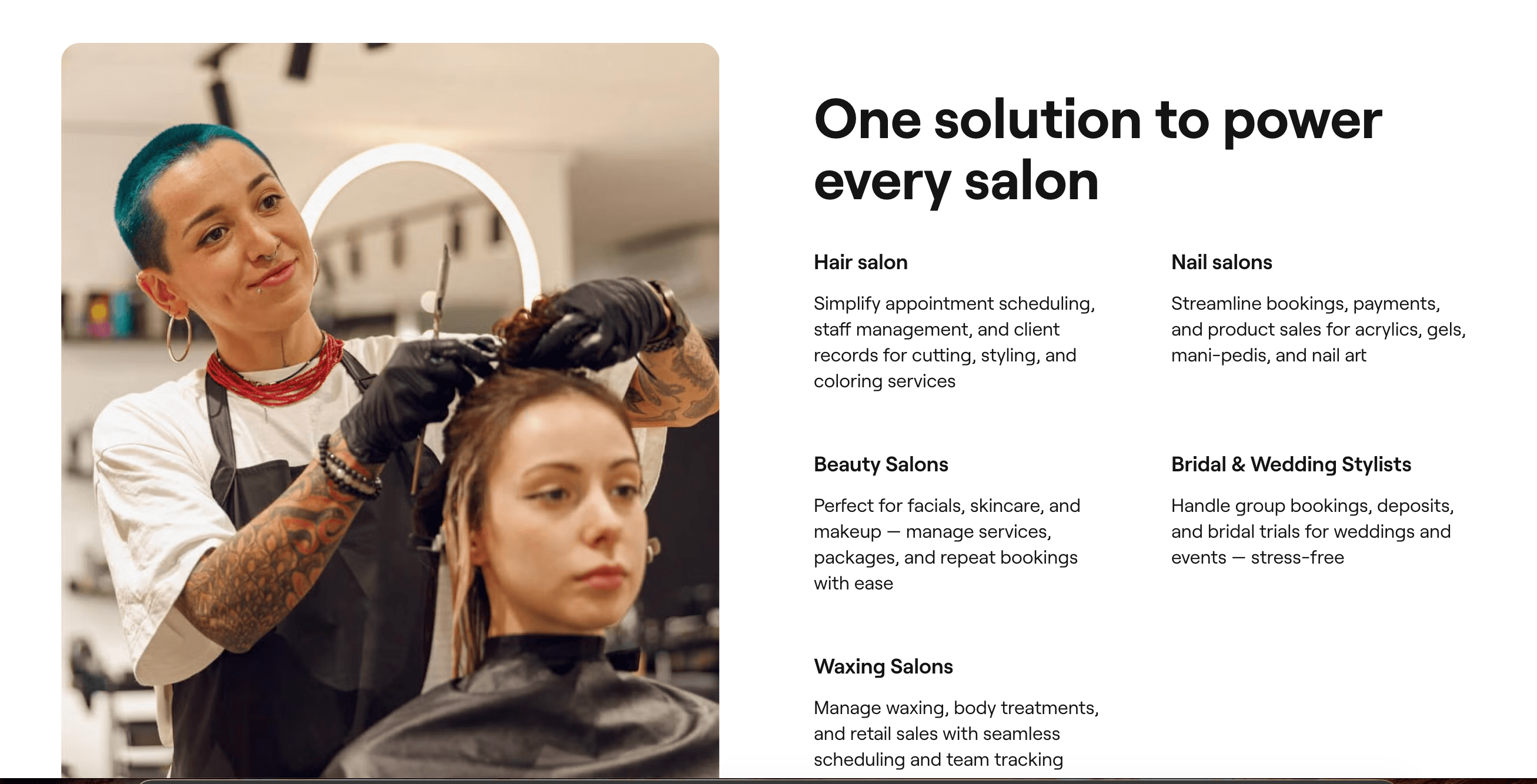 A hairstylist cutting a client's hair in a salon