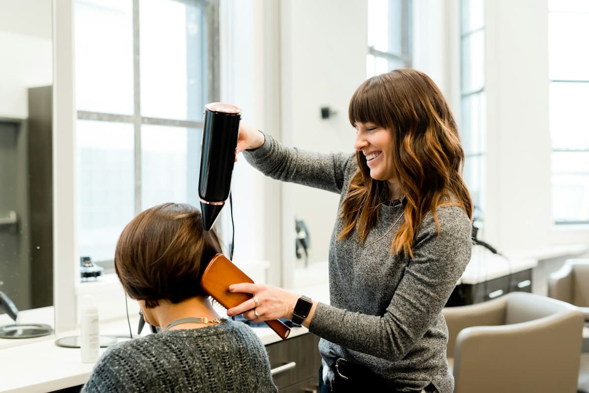 Professional styling a client's hair